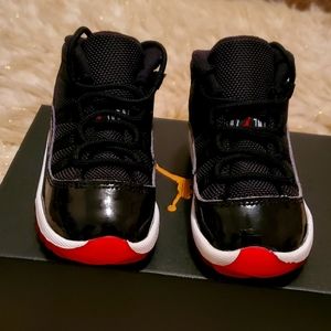 Jordan retro 11 size 6c black white and red
